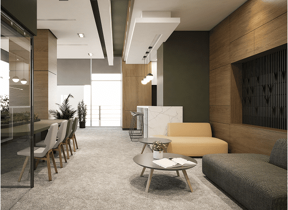 Modern office lounge with seating and tables.