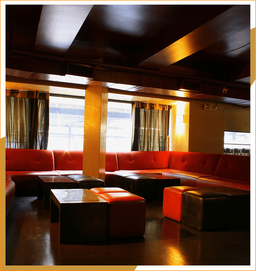 Cozy lounge with red and black seating.