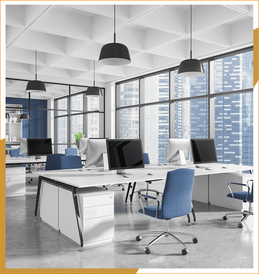 Modern office with computers and blue chairs.